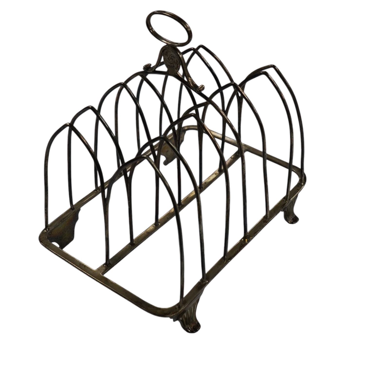 A George III silver seven bar toast rack, by Henry Chawner, London, 1795, with ring handle, length 14.7cm, 5.8oz. Condition - fair